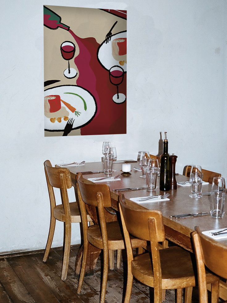 Photograph of a table set in a restaurant. Above the table, an illustrated poster showing a bottle of wine spilling onto the tablecloth between two plates.